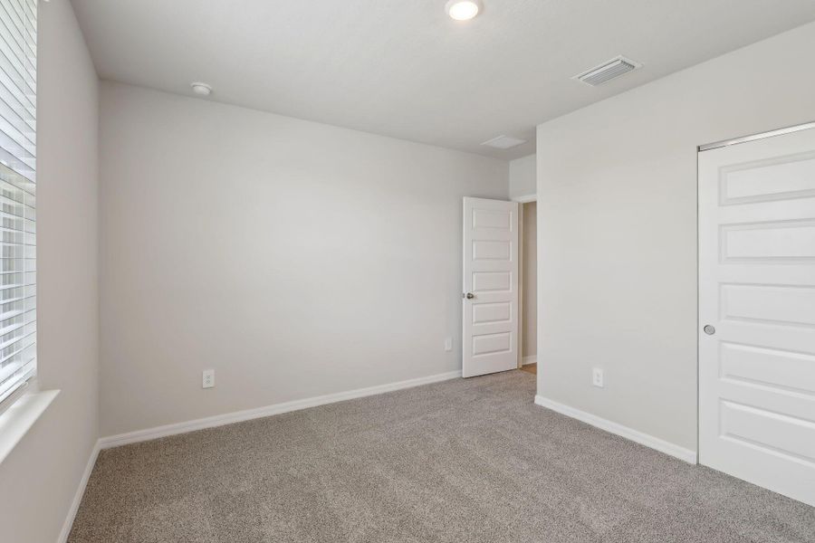 Spacious, unfurnished interior of a new home in Hampton Park - Classic Series, Vero Beach (Image 21).