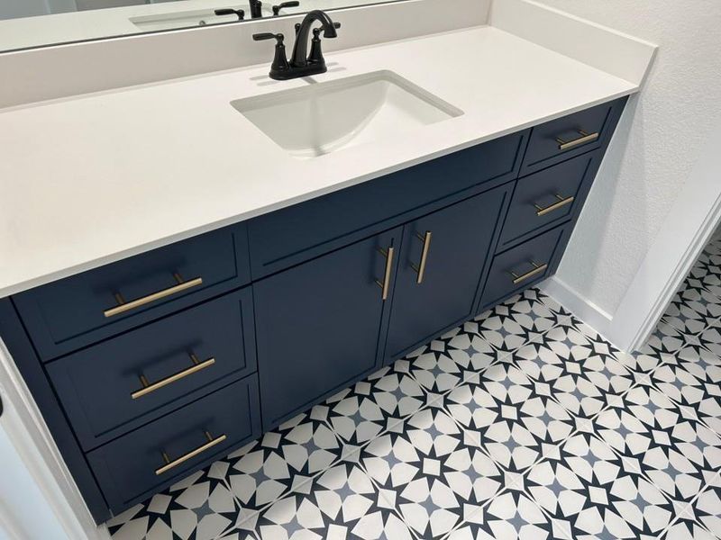 Bathroom with vanity and baseboards Bathroom with vanity and baseboards