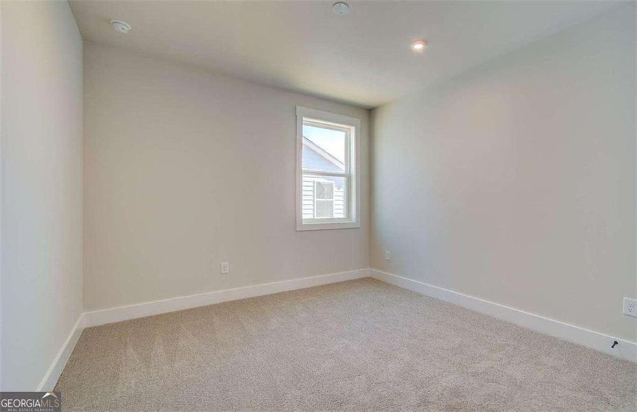 Spacious, unfurnished interior of a new home in The Paddocks at Doc Hughes, Buford (Image 29).