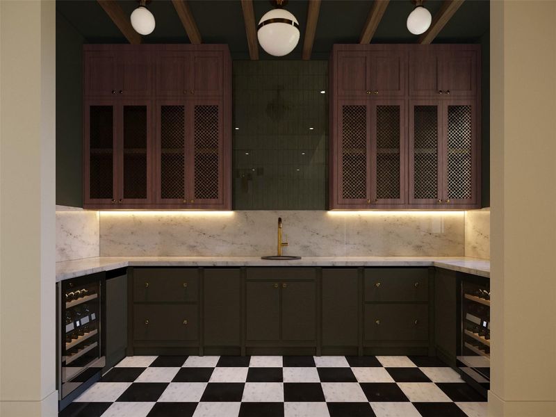 This designer wet bar exudes moody sophistication with its rich two-tone cabinetry, imported hand made brass display grills, and ambient under-cabinet lighting set against single cut marble and glossy green tile. Dual wine refrigerators and a checkerboard marble floor complete the perfect blend of form and function. This designer wet bar exudes moody sophistication with its rich two-tone cabinetry, imported hand made brass display grills, and ambient under-cabinet lighting set against single cut marble and glossy green tile. Dual wine refrigerators and a checkerboard marble floor complete the perfect blend of form and function.
