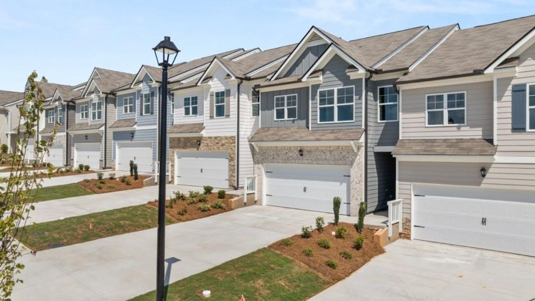 Front exterior of a new home in Rolling Meadows, Jasper, GA, highlighting curb appeal (Image 2). Front exterior of a new home in Rolling Meadows, Jasper, GA, highlighting curb appeal (Image 2).