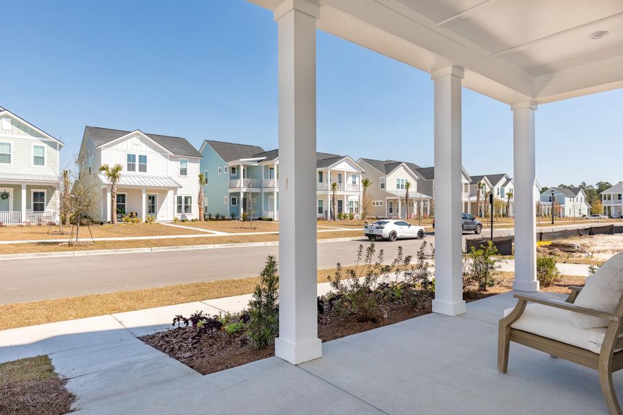 Exterior details and patio area of a home in Heron's Walk at Summers Corner: Row Collection, Summerville (Image 2).