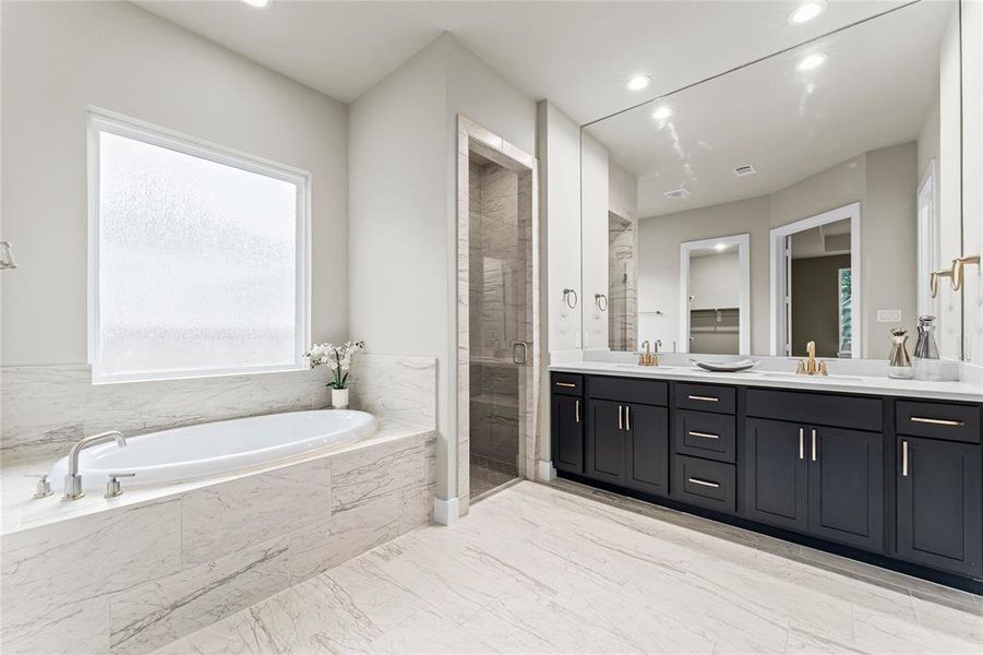 Soaking Tub, Separate Shower, and Double Sinks at the Primary Bathroom