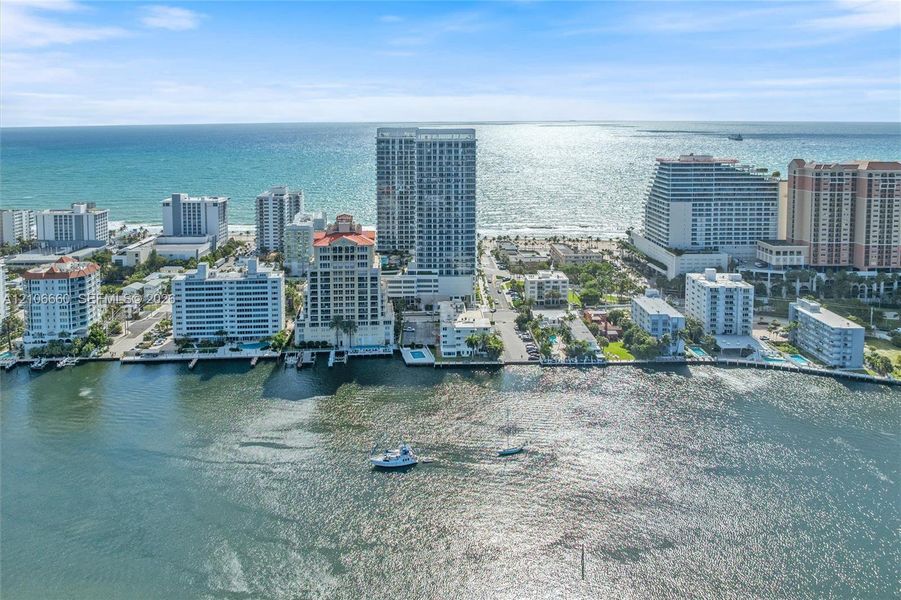 Coastal urban skyline featuring high-rise architecture, direct waterfront access, and expansive ocean frontage