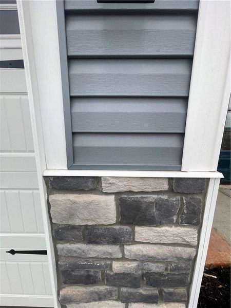 Exterior details and patio area of a home in Springwood Grove, Central (Image 3).