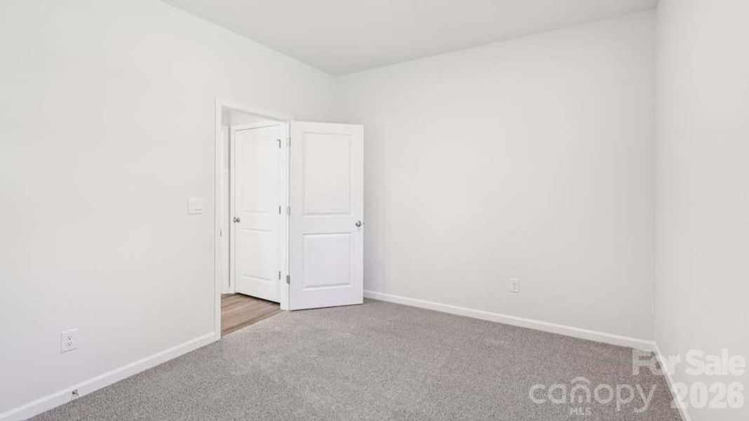 Spacious, unfurnished interior of a new home in Wallace Springs, Statesville (Image 25).