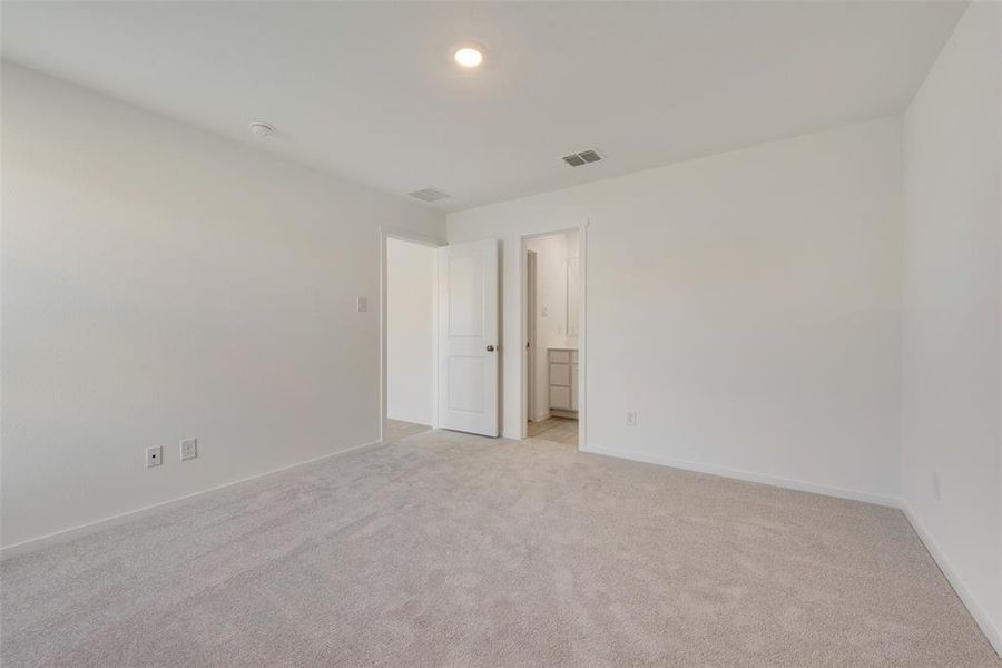 View of carpeted spare room