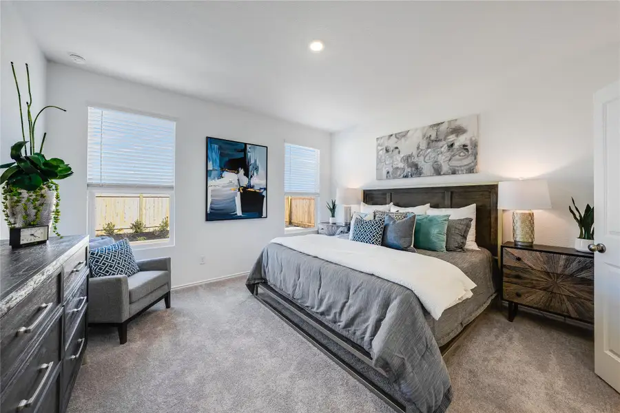 Carpeted bedroom featuring baseboards and recessed lighting