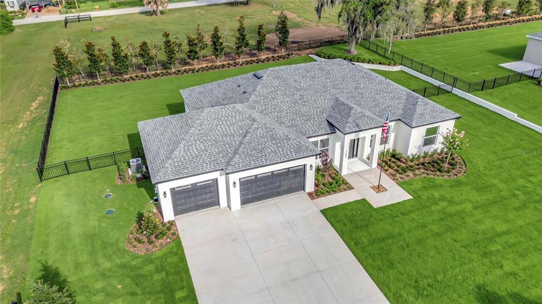Front exterior of a new home in , Montverde, FL, highlighting curb appeal (Image 22). Front exterior of a new home in , Montverde, FL, highlighting curb appeal (Image 22).