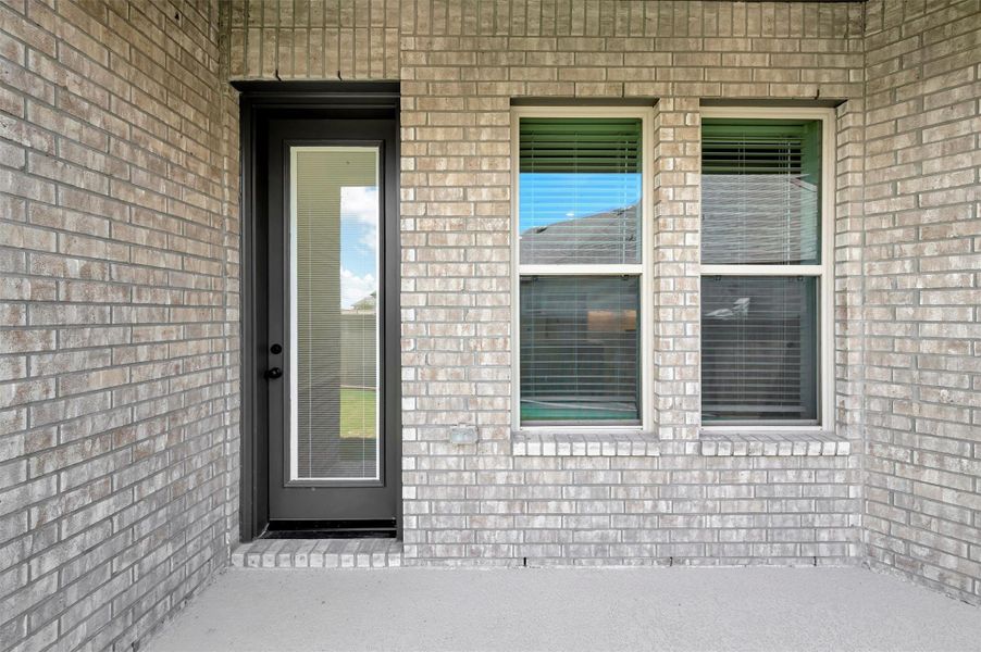 Exterior details and patio area of a home in Prairieland Village - Grove Collection, Cypress (Image 26). Exterior details and patio area of a home in Prairieland Village - Grove Collection, Cypress (Image 26).