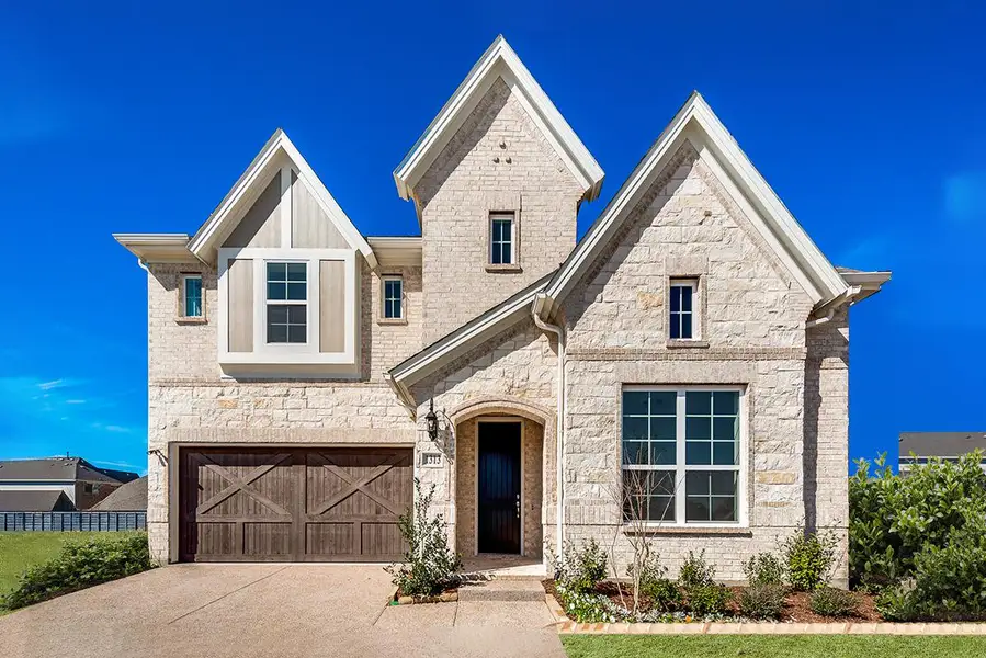 Representative exterior photo of a completed home built from the Charleston II by Grand Homes in Providence Cove, McKinney, TX (Image 1).