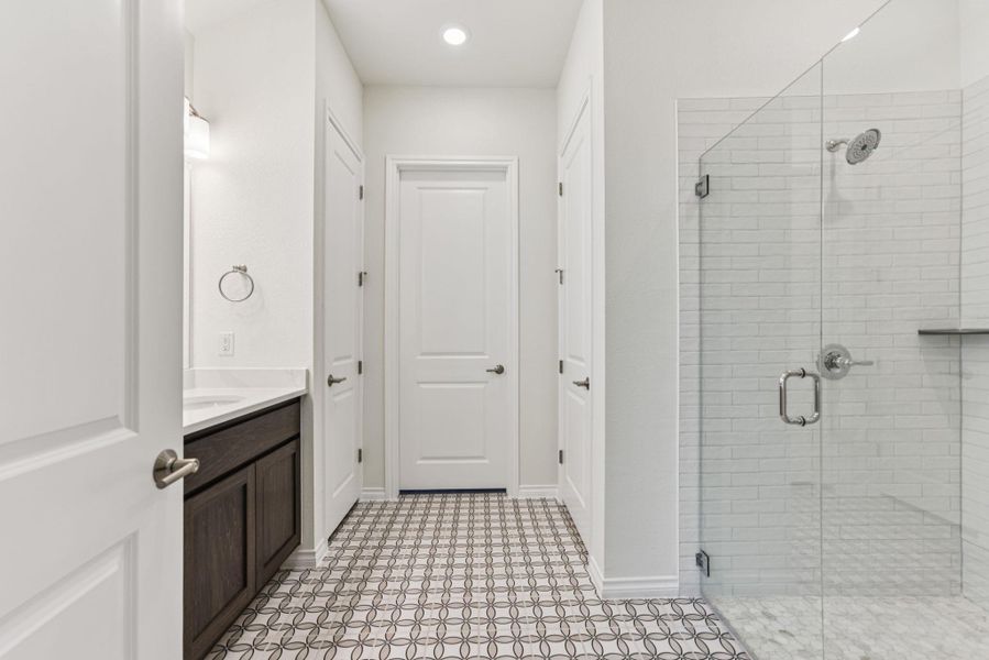Full bath featuring a shower stall, vanity, and recessed lighting Full bath featuring a shower stall, vanity, and recessed lighting