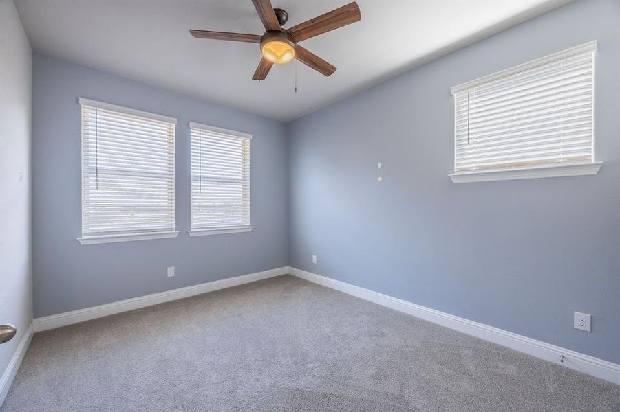 12' x 10' Secondary bedroom, with ceiling fan and window blinds - View