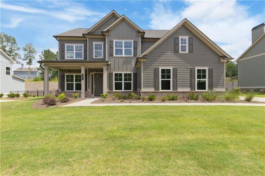Front exterior of a home in the Traditions of Braselton community, located in Jefferson, GA (Image 9). Front exterior of a home in the Traditions of Braselton community, located in Jefferson, GA (Image 9).