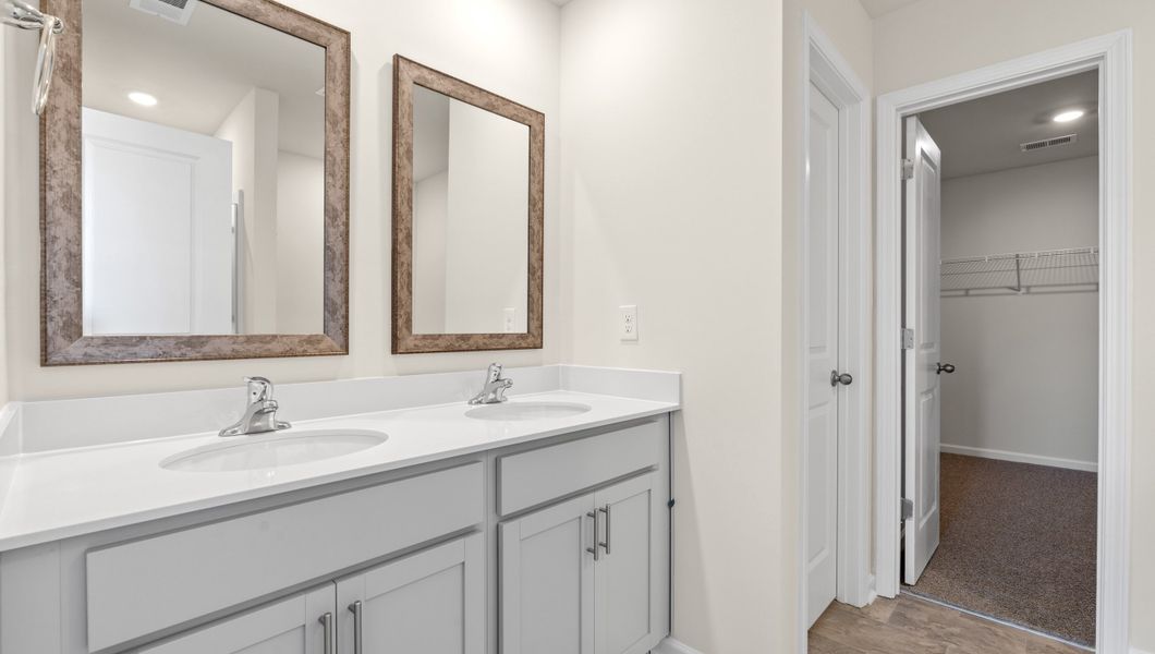 Representative furnished interior of a home built from the WILMINGTON by D.R. Horton in Benjamin's Grove, Woodruff (Image 13).