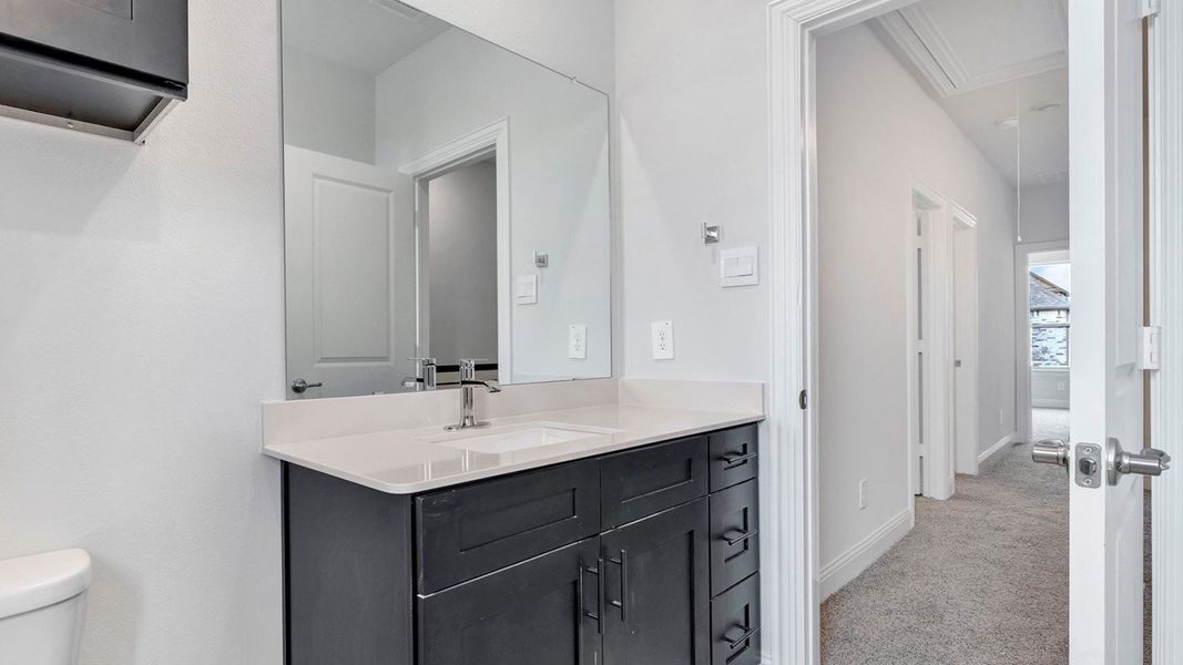 Representative furnished interior of a home built from the Derby by D.R. Horton in Mustang Square, Plano (Image 10).