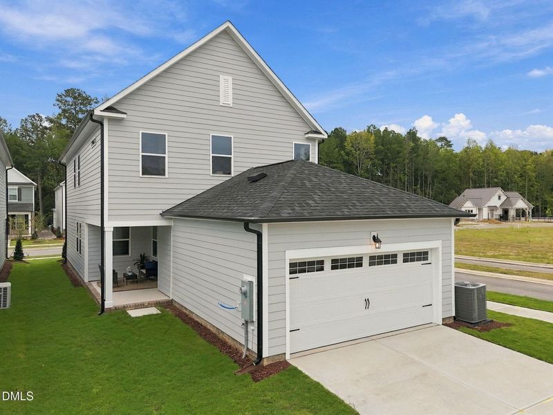 Front exterior of a new home in Forestville Yard, Knightdale, NC, highlighting curb appeal (Image 28). Front exterior of a new home in Forestville Yard, Knightdale, NC, highlighting curb appeal (Image 28).