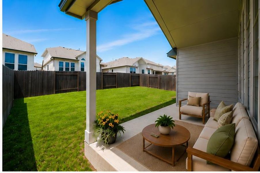 A spacious backyard with an inviting covered patio provides ample space for outdoor living.