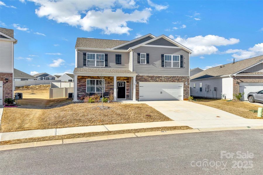 Front exterior of a new home in , Simpsonville, SC, highlighting curb appeal (Image 21).