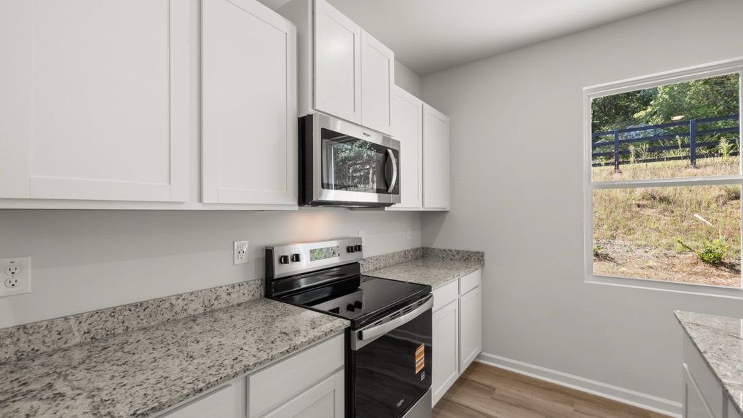 Representative furnished interior of a home built from the Belhaven by D.R. Horton in Creekview, Atlanta (Image 8).