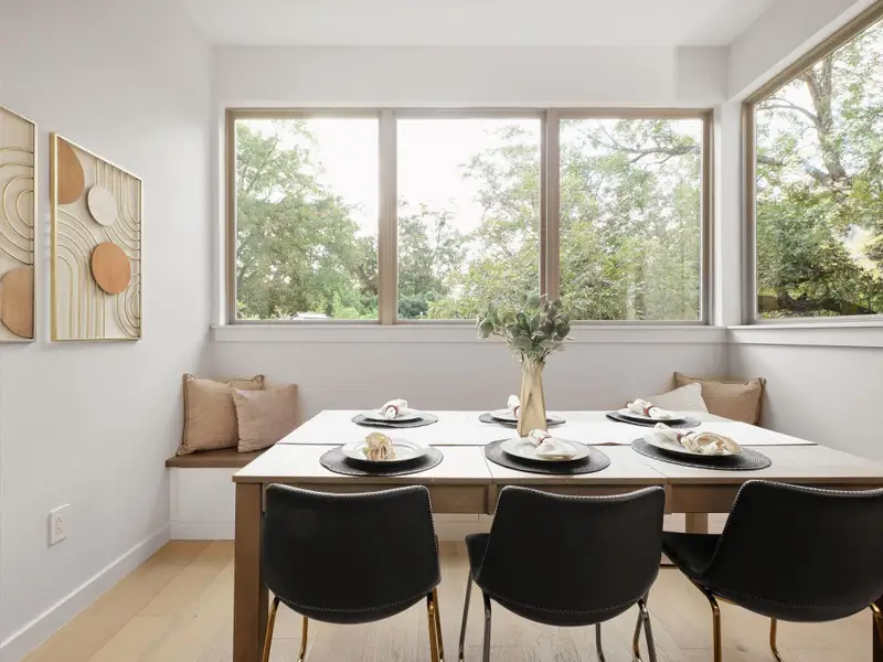 Dining area with light wood-type flooring and baseboards