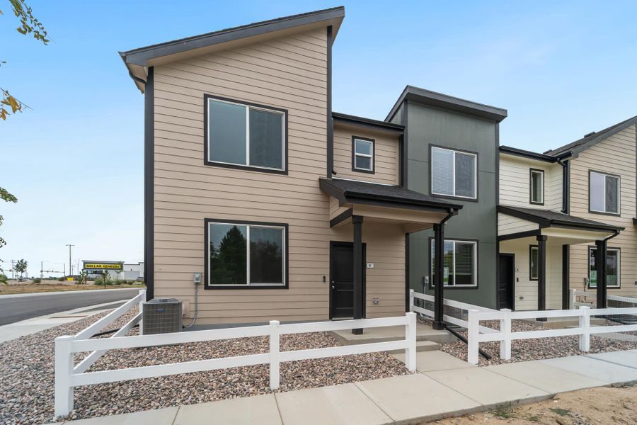 Front exterior of a new home in Conestoga, Ault, CO, highlighting curb appeal (Image 2). Front exterior of a new home in Conestoga, Ault, CO, highlighting curb appeal (Image 2).