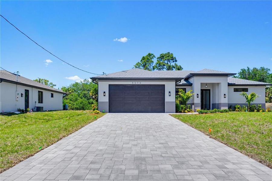 Front exterior of a new home in , North Port, FL, highlighting curb appeal (Image 25).