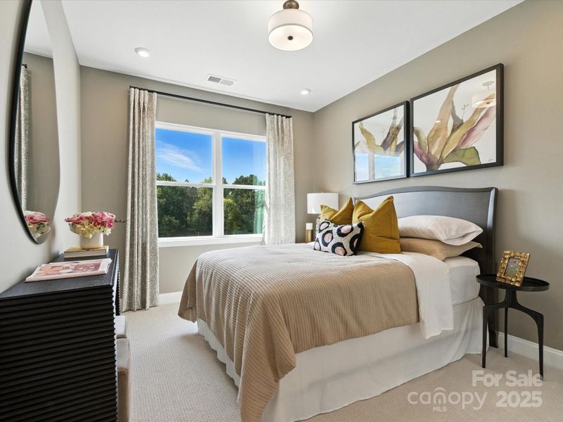 Secondary bedroom that feels larger than most with 9' ceilings. *Model Photos | Actual finishes, orientation, and structural selections may vary.