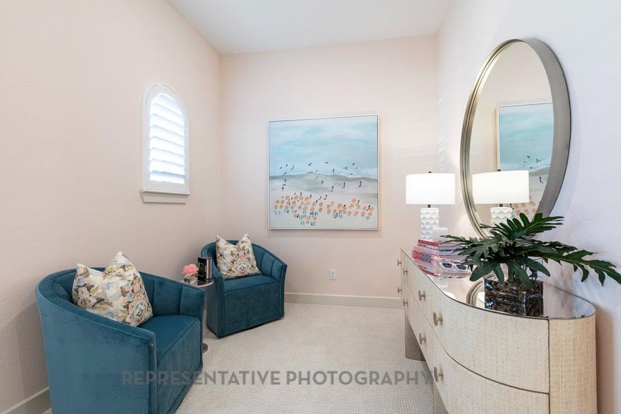 Living area featuring carpet and baseboards Living area featuring carpet and baseboards