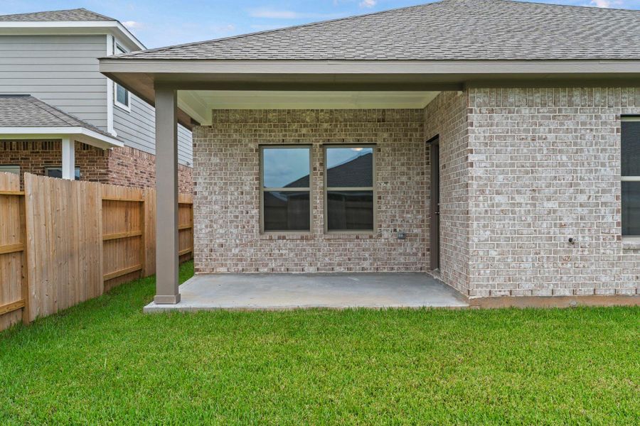 Exterior details and patio area of a home in Windrose Green, Angleton (Image 16). Exterior details and patio area of a home in Windrose Green, Angleton (Image 16).