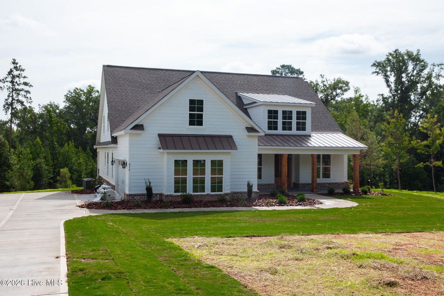Front exterior of a new home in Marshall Mills, Grovetown, GA, highlighting curb appeal (Image 2). Front exterior of a new home in Marshall Mills, Grovetown, GA, highlighting curb appeal (Image 2).