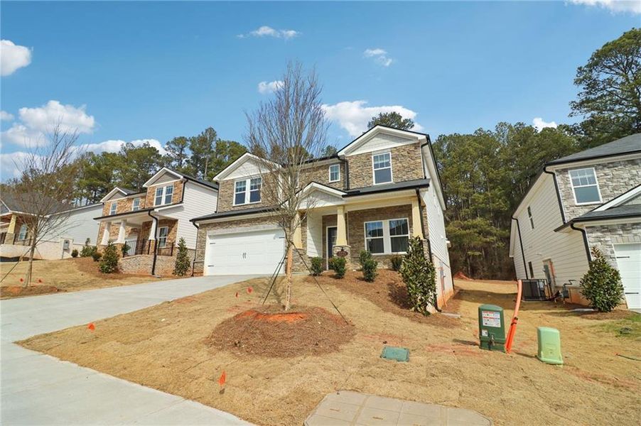 Front exterior of a new home in Harmony Manor, Fairburn, GA, highlighting curb appeal (Image 26).
