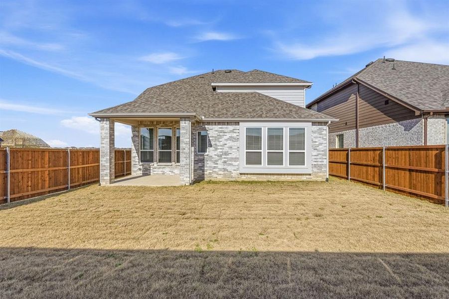 Exterior details and patio area of a home in Sandbrock Ranch, Aubrey (Image 2). Exterior details and patio area of a home in Sandbrock Ranch, Aubrey (Image 2).