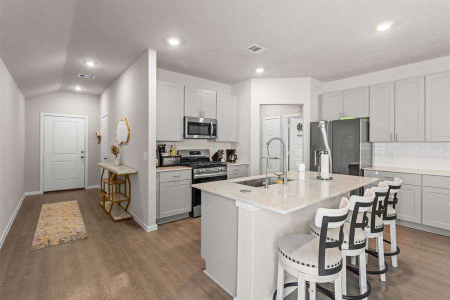 Upgraded kitchen with granite counter top and smart appliances that are included with the purchase of the home Upgraded kitchen with granite counter top and smart appliances that are included with the purchase of the home