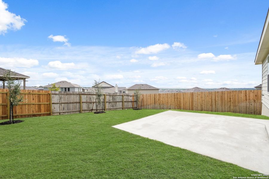 Front exterior of a new home in Cinco Lakes, San Antonio, TX, highlighting curb appeal (Image 21).