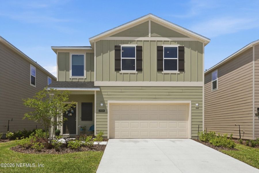 Front exterior of a new home in Holstein Crossing, Green Cove Springs, FL, highlighting curb appeal (Image 2).