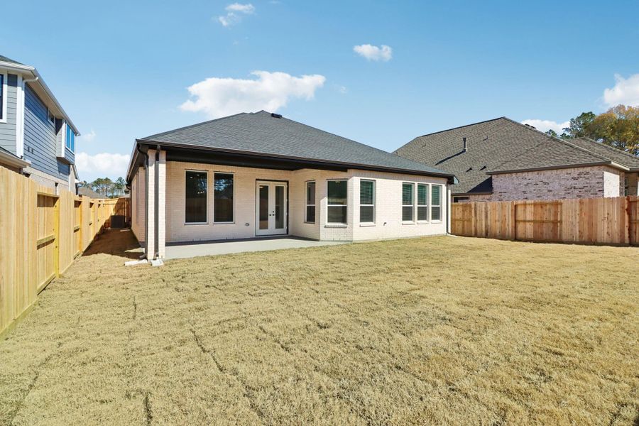 Exterior details and patio area of a home in The Highlands, Porter (Image 20).