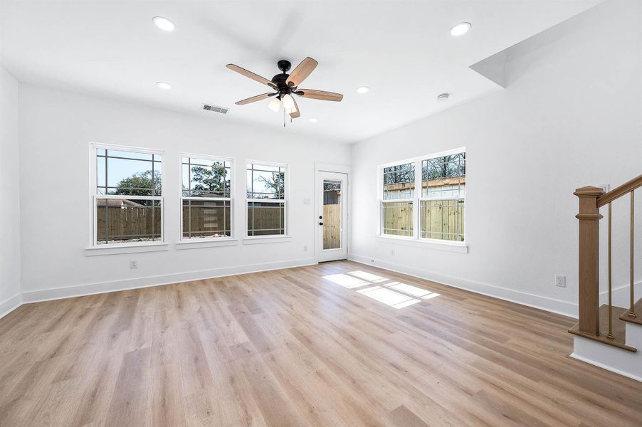 Spacious living room with large windows and easy outdoor access.