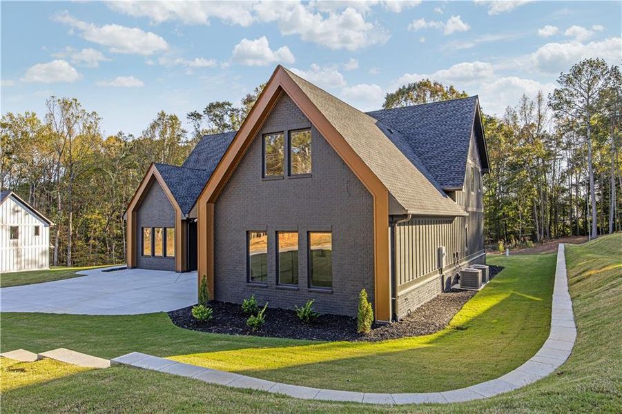 Front exterior of a new home in , Auburn, GA, highlighting curb appeal (Image 2).