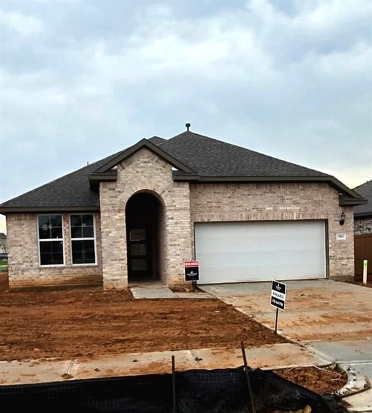 Front exterior of a new home in Sunterra, Katy, TX, highlighting curb appeal (Image 5).