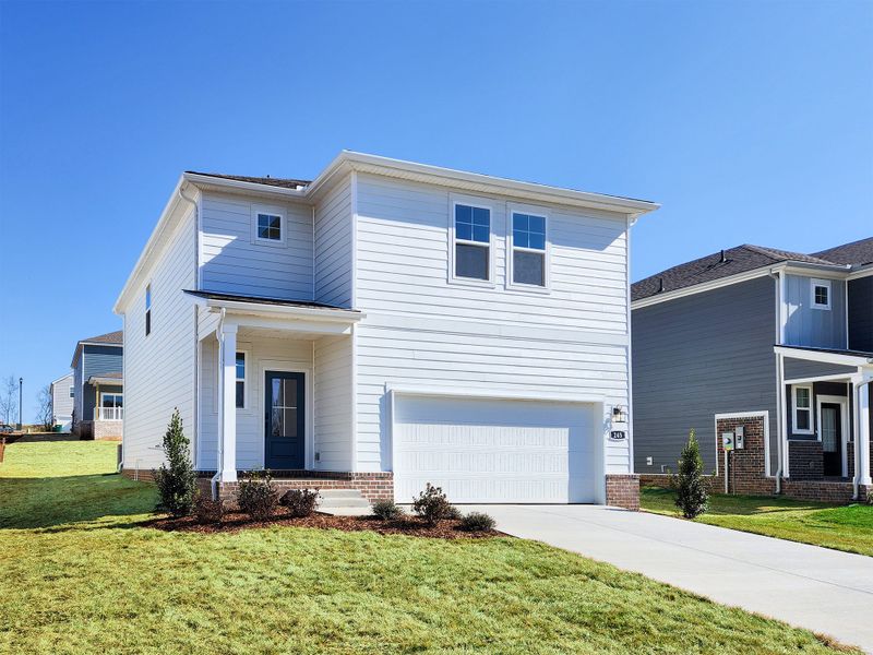 A white house with a garage. A white house with a garage.