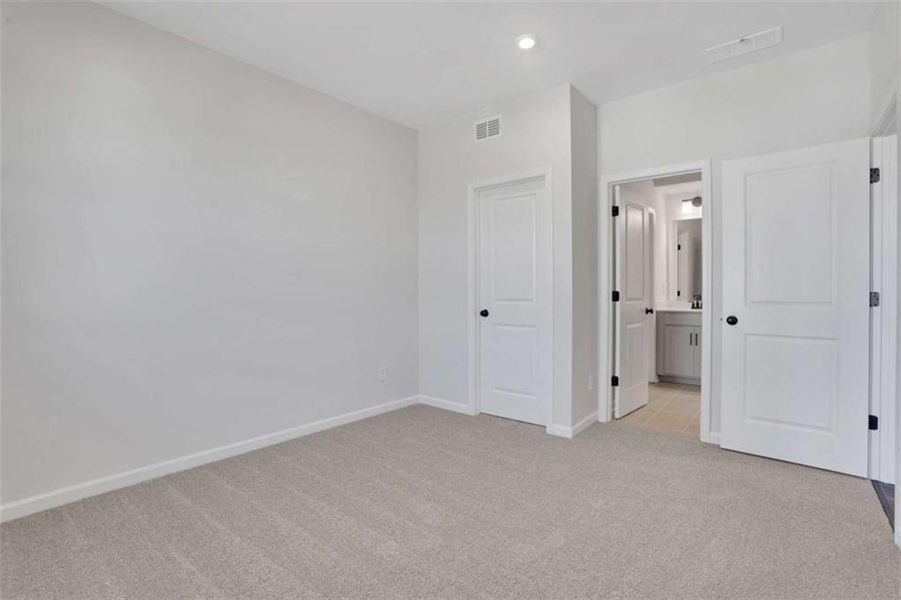 Spacious, unfurnished interior of a new home in The Paddocks at Doc Hughes, Buford (Image 47).
