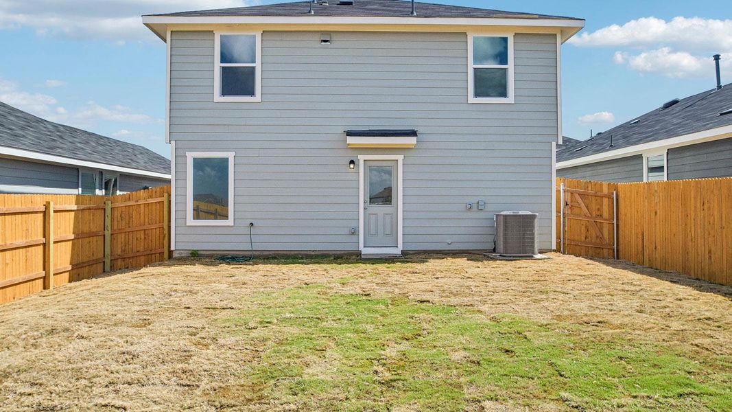 Exterior details and patio area of a home in Prairie Lakes, Buda (Image 19).