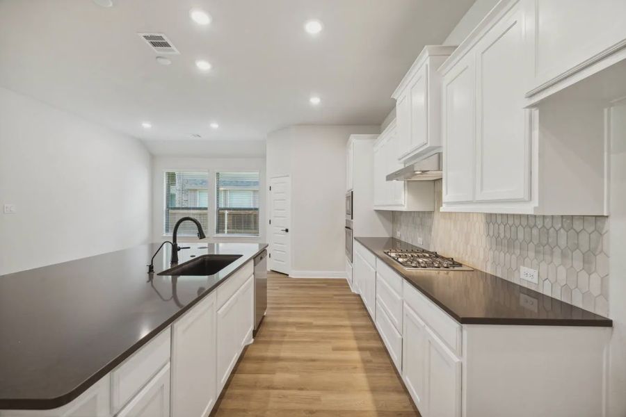 Representative furnished interior of a home built from the Caldwell by Chesmar Homes in Summer Crest, Crowley (Image 5).
