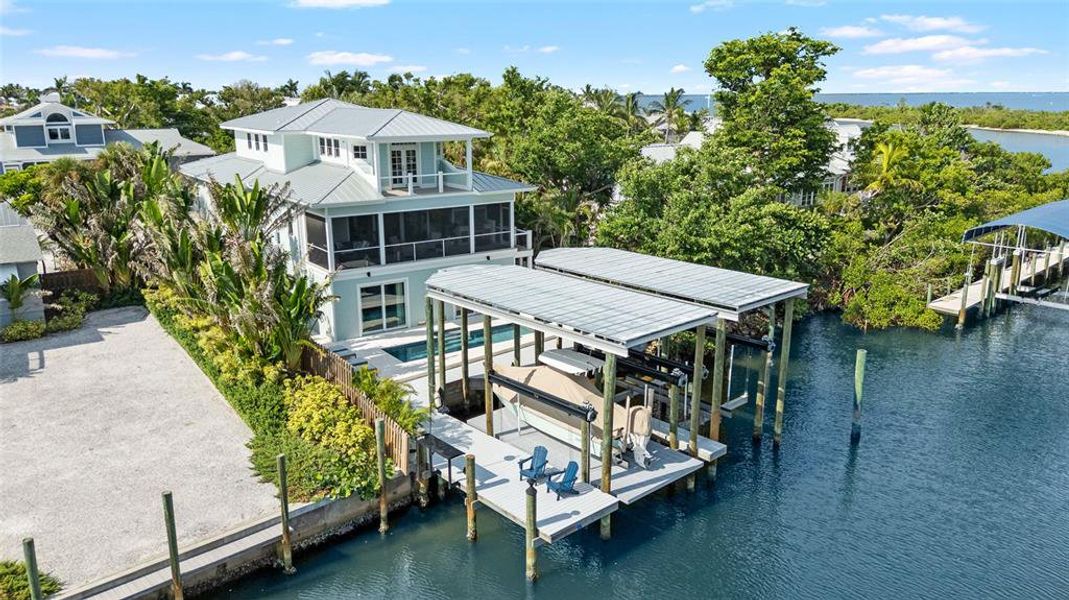 Front exterior of a new home in , Boca Grande, FL, highlighting curb appeal (Image 1). Front exterior of a new home in , Boca Grande, FL, highlighting curb appeal (Image 1).