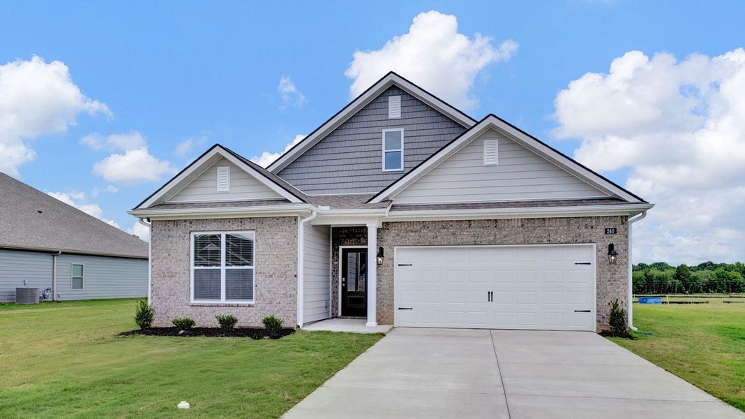 Front exterior of a new home in The Orchard, Millington, TN, highlighting curb appeal (Image 1). Front exterior of a new home in The Orchard, Millington, TN, highlighting curb appeal (Image 1).
