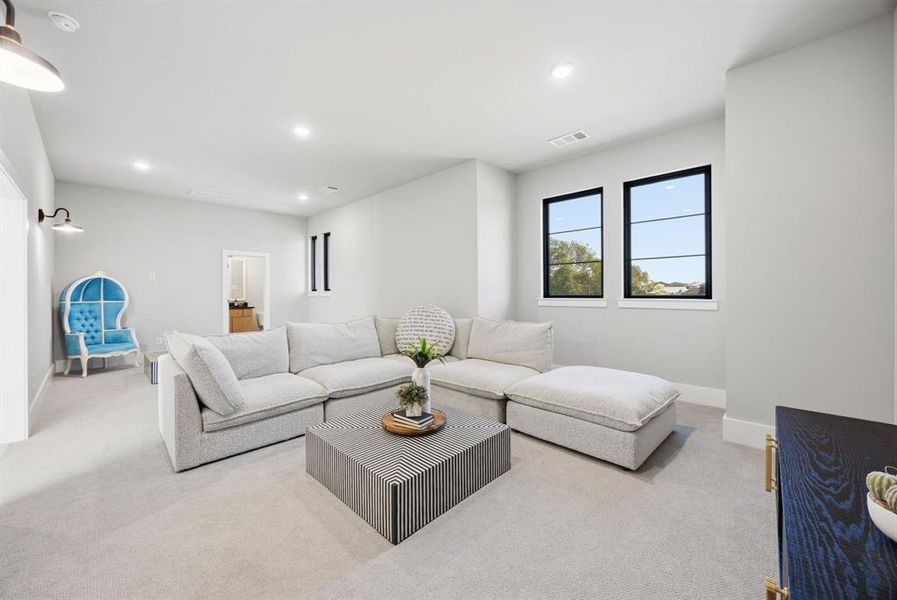 Upstairs game/media room is HUGE and has a half bath! If you wanted to divide the space into a smaller game room with a bed and full bath, there is a ton of space in the walk in attic just behind that wall that could be taken in to accommodate a shower and closet. Upstairs game/media room is HUGE and has a half bath! If you wanted to divide the space into a smaller game room with a bed and full bath, there is a ton of space in the walk in attic just behind that wall that could be taken in to accommodate a shower and closet.