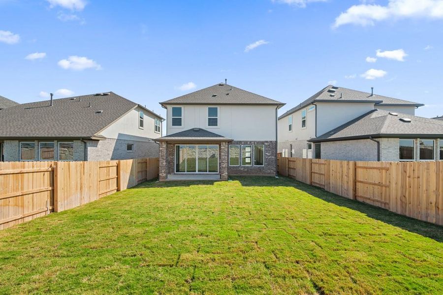 Exterior details and patio area of a home in Flora, Hutto (Image 1).