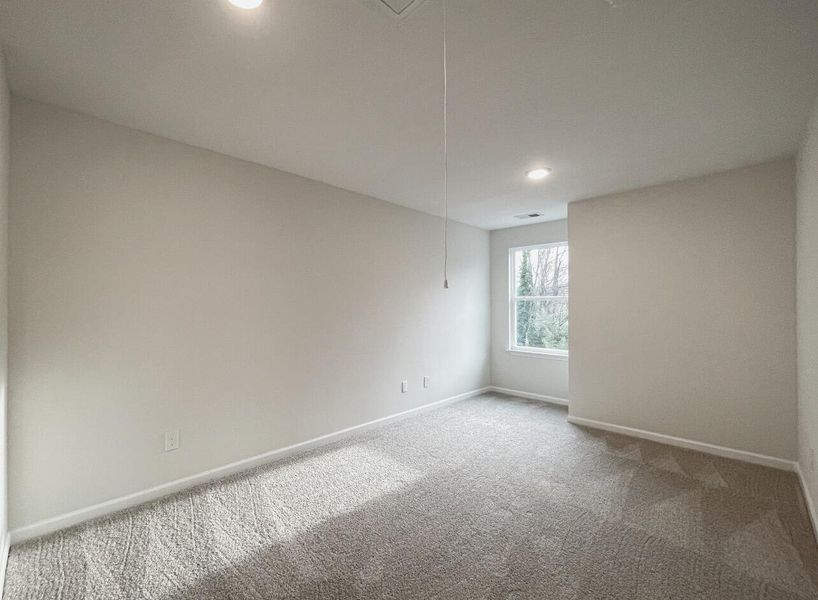 Spacious, unfurnished interior of a new home in East Main Townes, Spartanburg (Image 18).