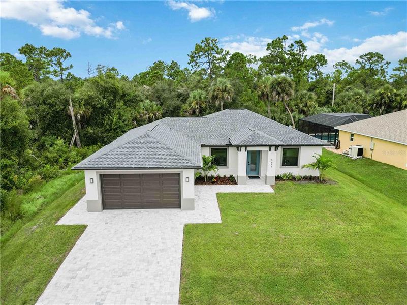 Front exterior of a new home in , North Port, FL, highlighting curb appeal (Image 22).